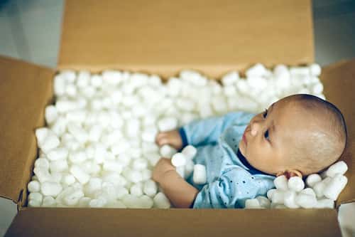 baby in a packing box
