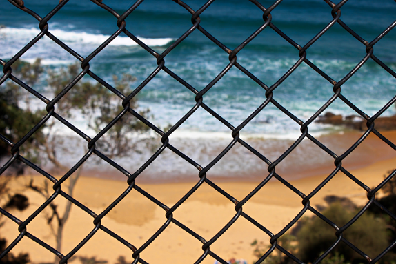beach through the fence