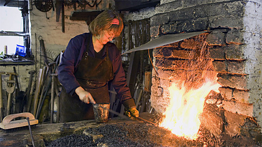Woman Forging Metal