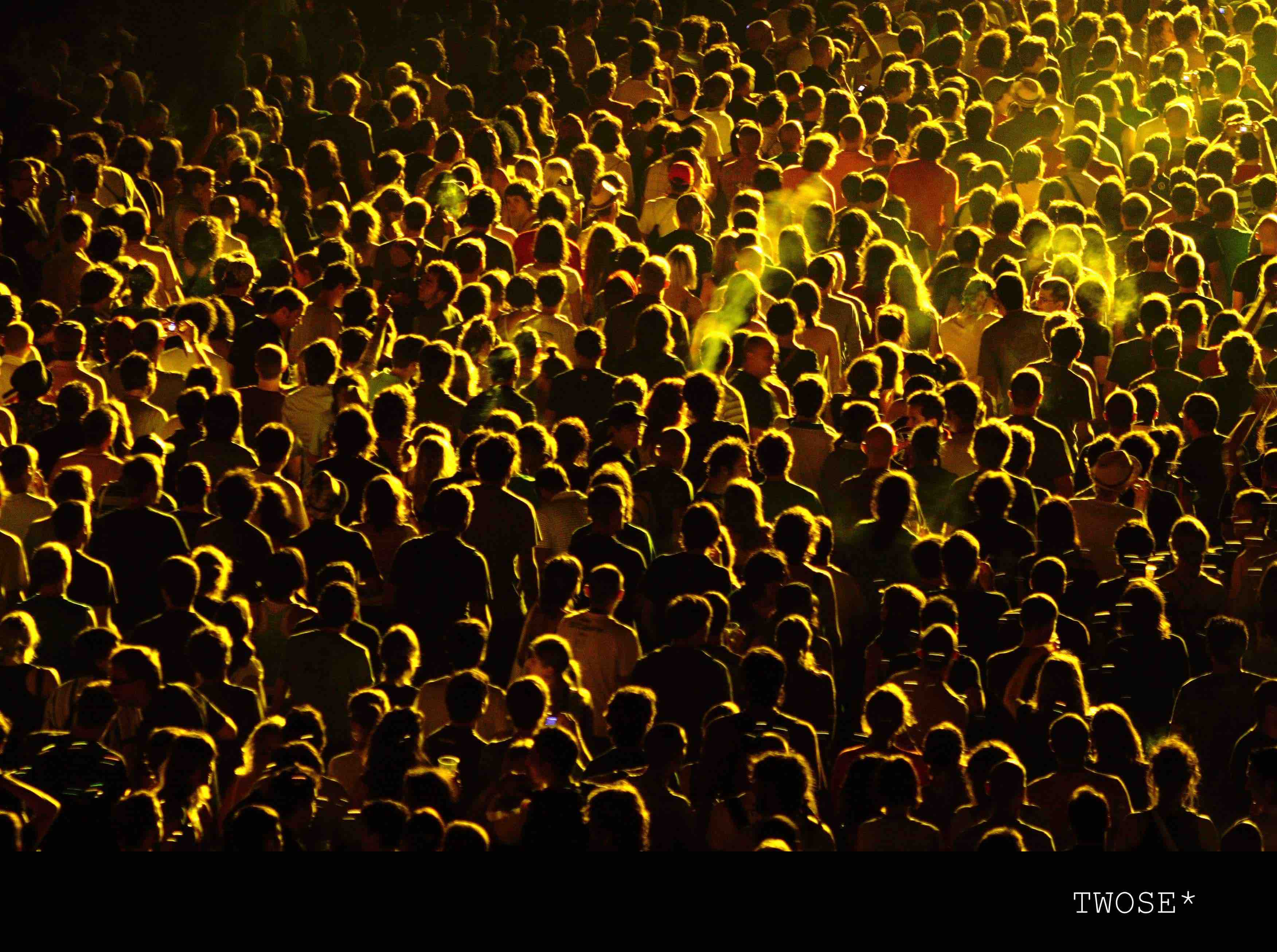homogenous crowd with yellow light