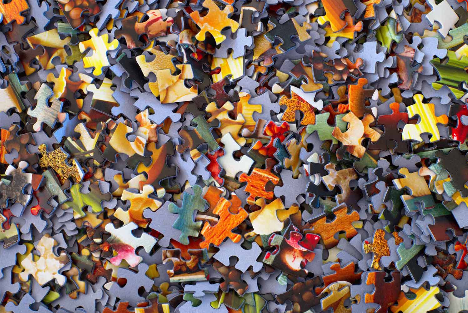 puzzles pieces all over a table